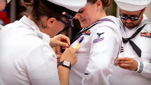 Photo pinning on a medal.