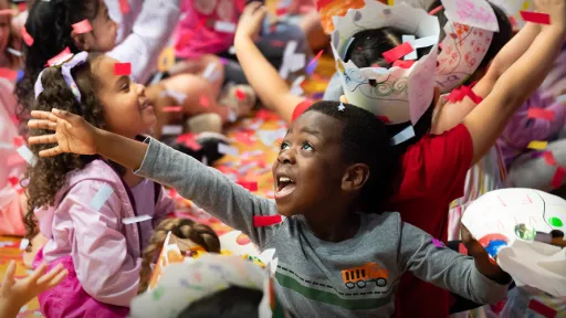 Child cheering at the River Parade.